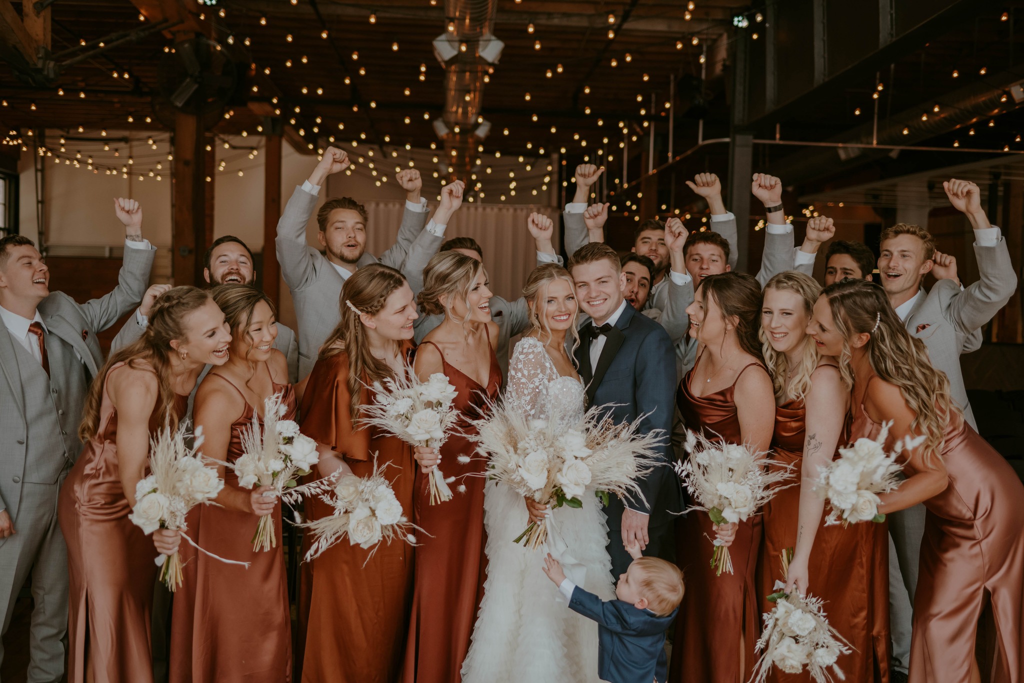 Bridesmaids, Groomsmen, and Bride and Groom at their Reception at The Everly